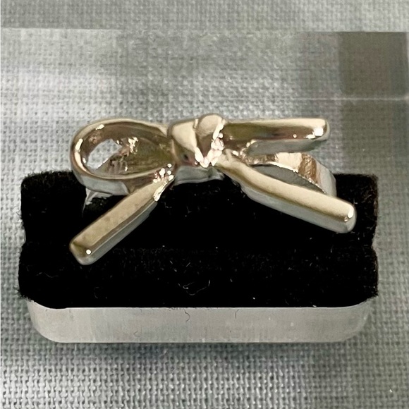 NWT Bow Ring- 14K White Gold
Plated Zinc Alloy. Great for Any Day! MSRP $27.99 - Picture 2 of 6